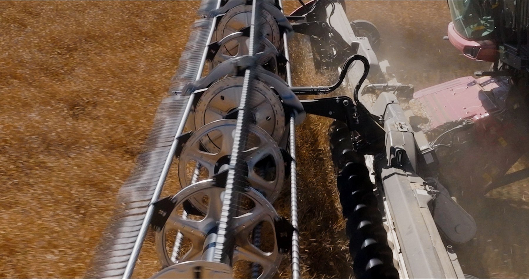Close-up of Case combine header in field